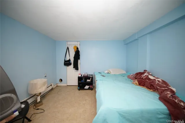 a bedroom with a bed and cabinets