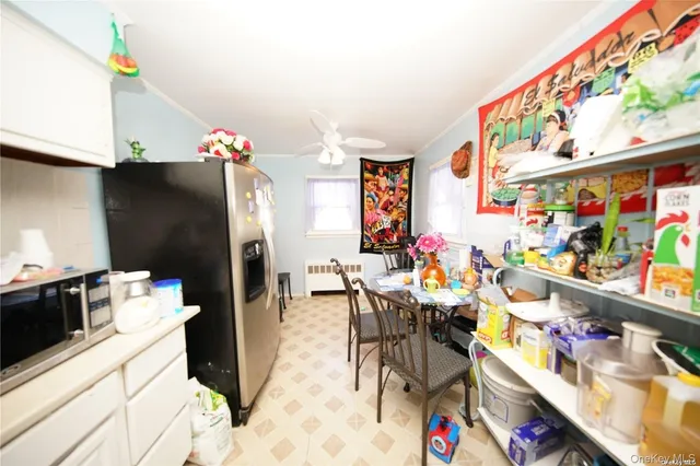 a view of dining room with furniture and a window