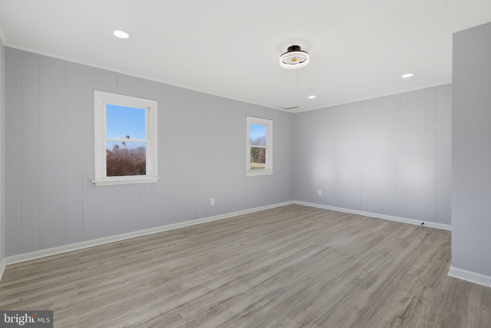 5020 Tucker Hill Road Hague, VA 22469 - Photo 28 of 31 a view of an empty room with wooden floor and a window