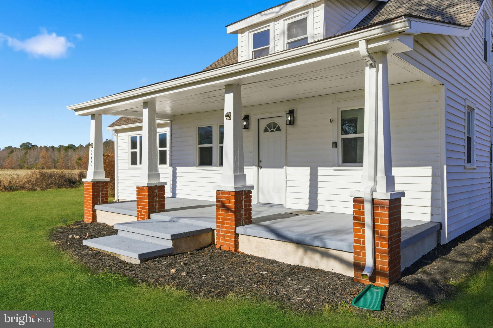 5020 Tucker Hill Road Hague, VA 22469 - Photo 3 of 31 a front view of a house with garden