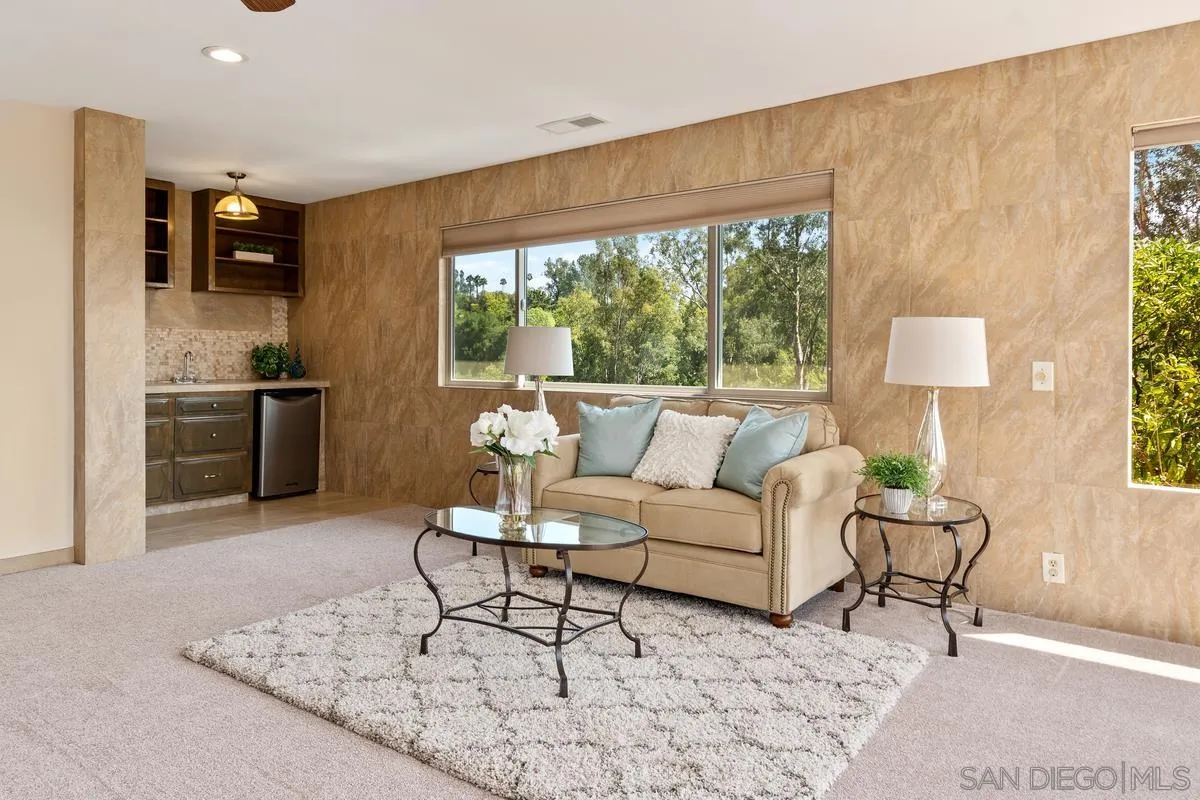 13502 Orchard Gate Road Poway, CA 92064 - Photo 18 of 42 a living room with furniture and a large window
