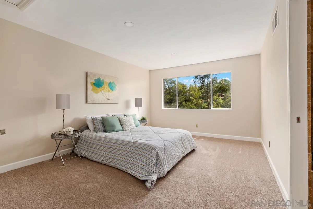13502 Orchard Gate Road Poway, CA 92064 - Photo 21 of 42 a bedroom with a bed painting and wall painting