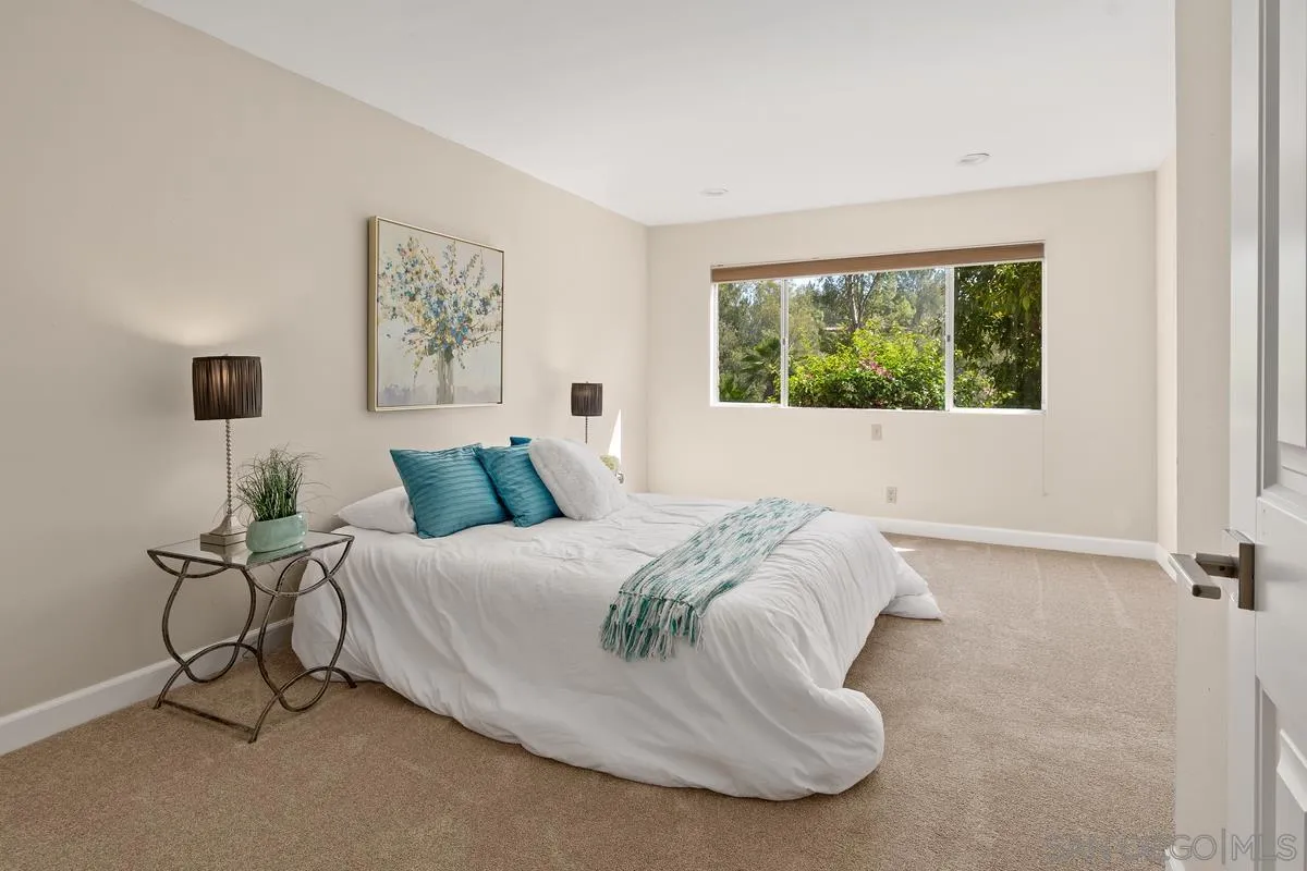 13502 Orchard Gate Road Poway, CA 92064 - Photo 23 of 42 a spacious bedroom with a bed and window