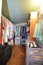 810 Julien Street Belvidere, IL 61008 - Photo 12 of 17 a living room with a couch and a stove next to a window