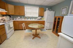 810 Julien Street Belvidere, IL 61008 - Photo 2 of 17 a kitchen with refrigerator and window
