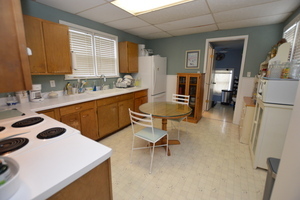810 Julien Street Belvidere, IL 61008 - Photo 3 of 17 a kitchen that has a sink a stove and chair