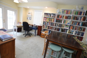 810 Julien Street Belvidere, IL 61008 - Photo 6 of 17 a view of a workspace with furniture and a bookshelf