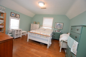 810 Julien Street Belvidere, IL 61008 - Photo 8 of 17 a bedroom with a bed and a chair