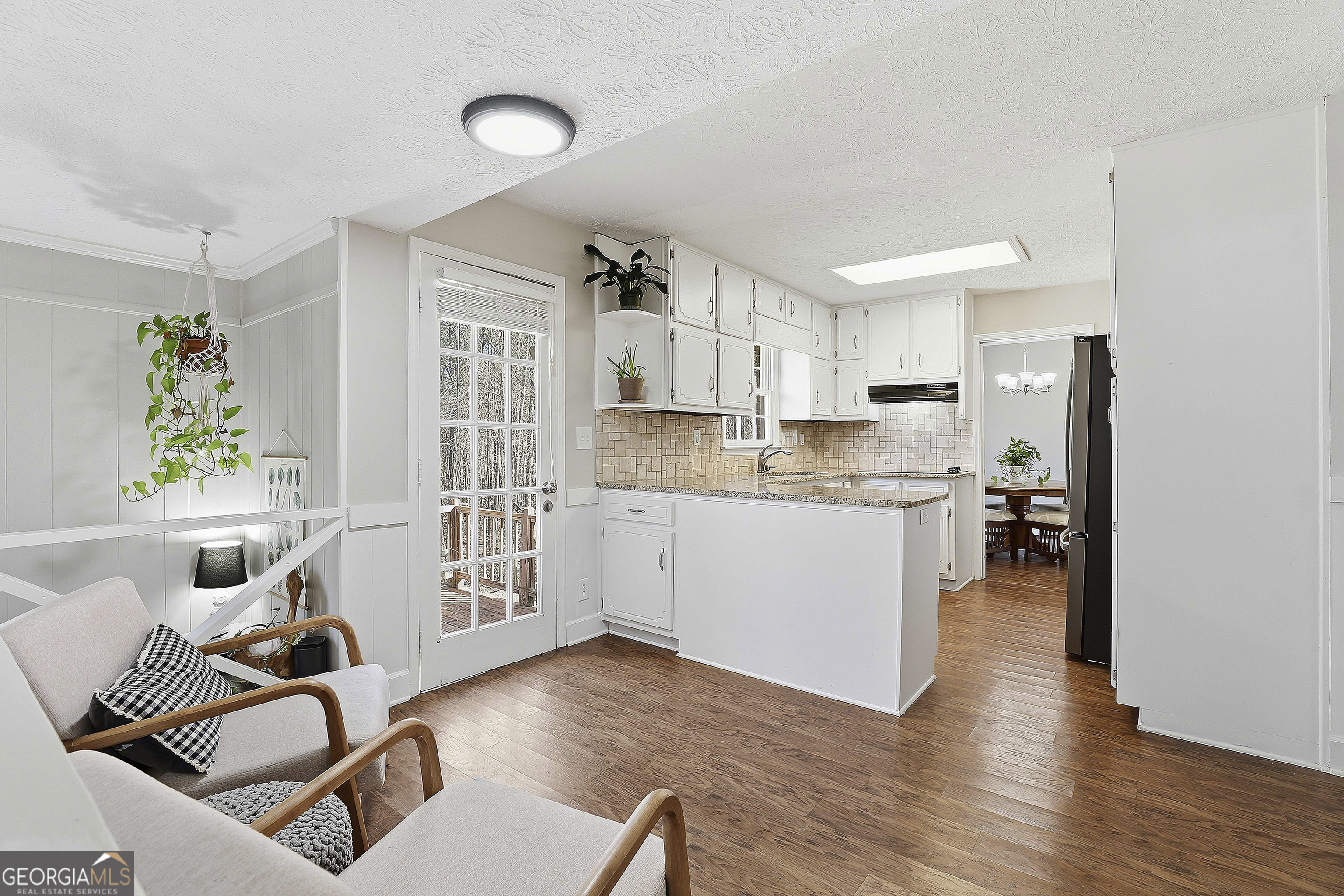 180 Lockwood Road Fayetteville, GA 30215 - Photo 16 of 59 a kitchen with stainless steel appliances granite countertop a refrigerator and a stove top oven