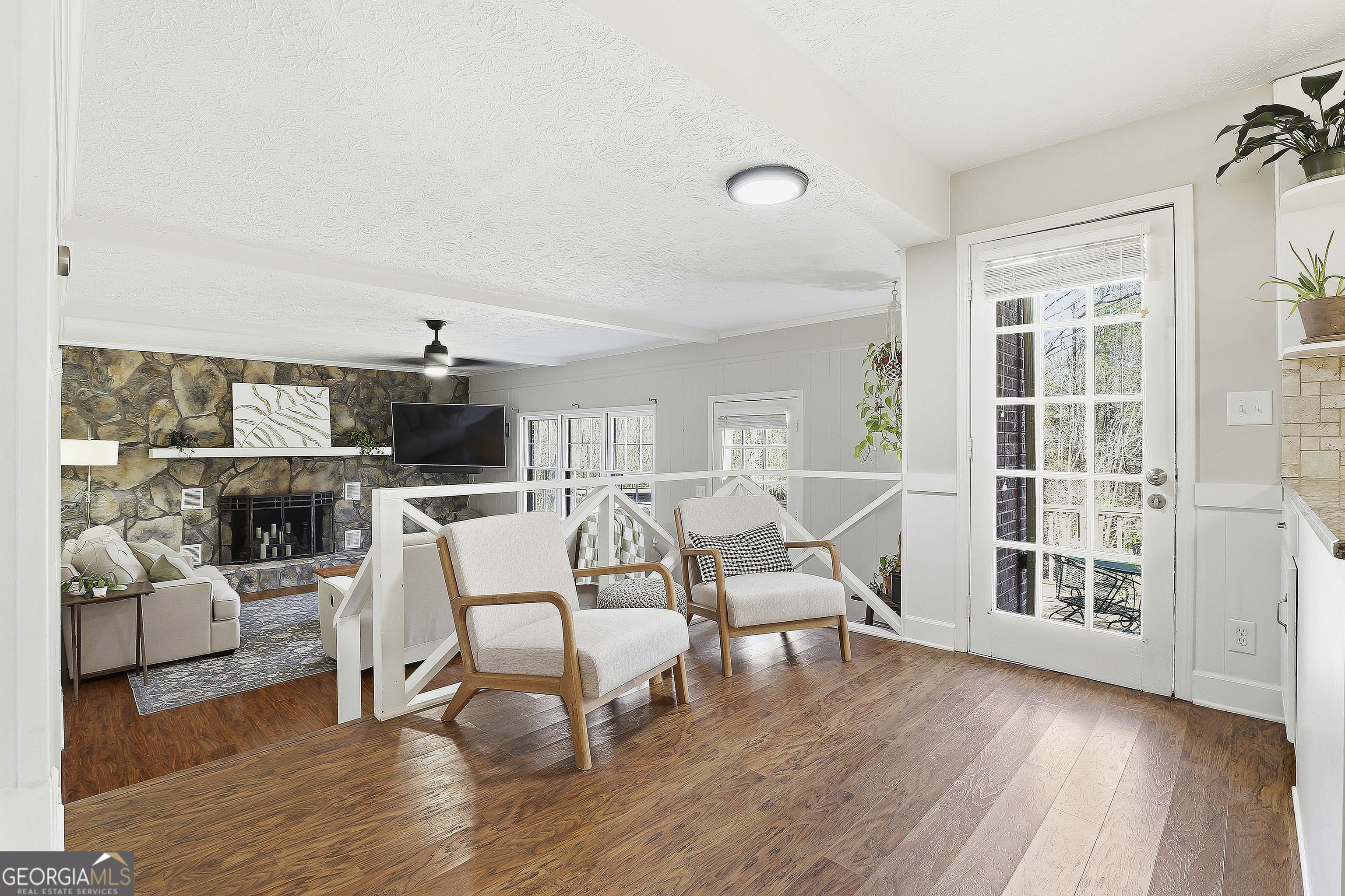 180 Lockwood Road Fayetteville, GA 30215 - Photo 19 of 59 a living room with furniture and a floor to ceiling window
