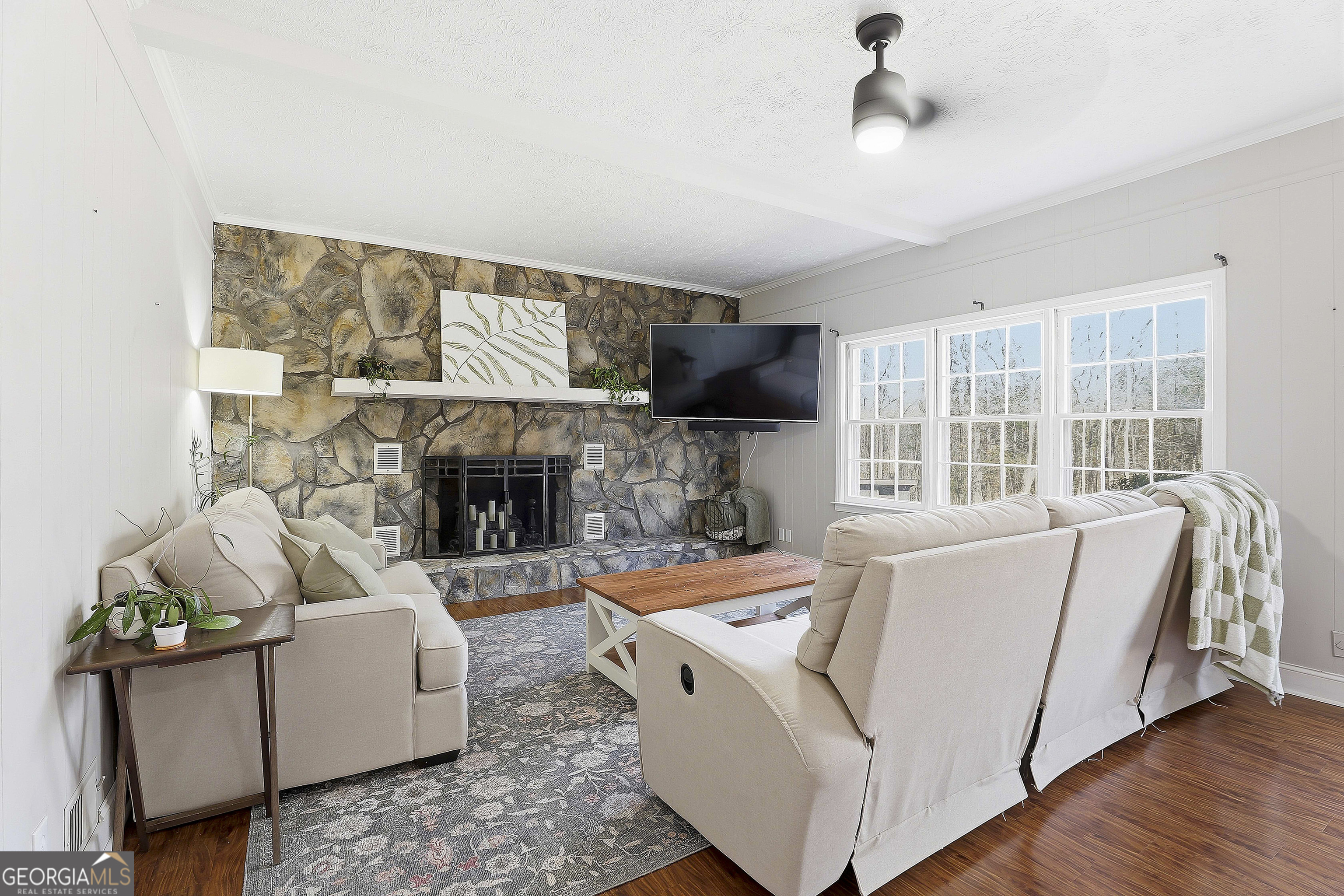 180 Lockwood Road Fayetteville, GA 30215 - Photo 20 of 59 a living room with furniture and a fireplace