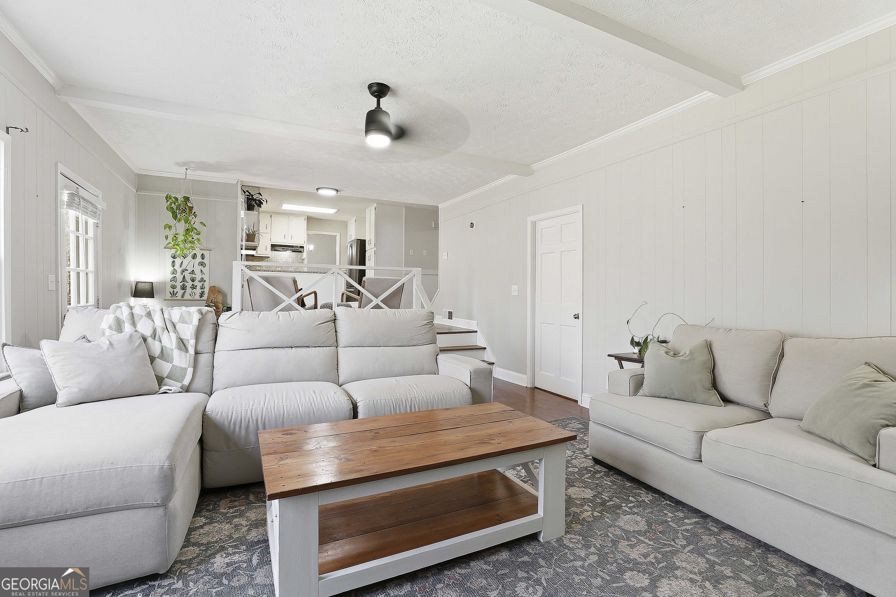 180 Lockwood Road Fayetteville, GA 30215 - Photo 22 of 59 a living room with furniture and a chandelier