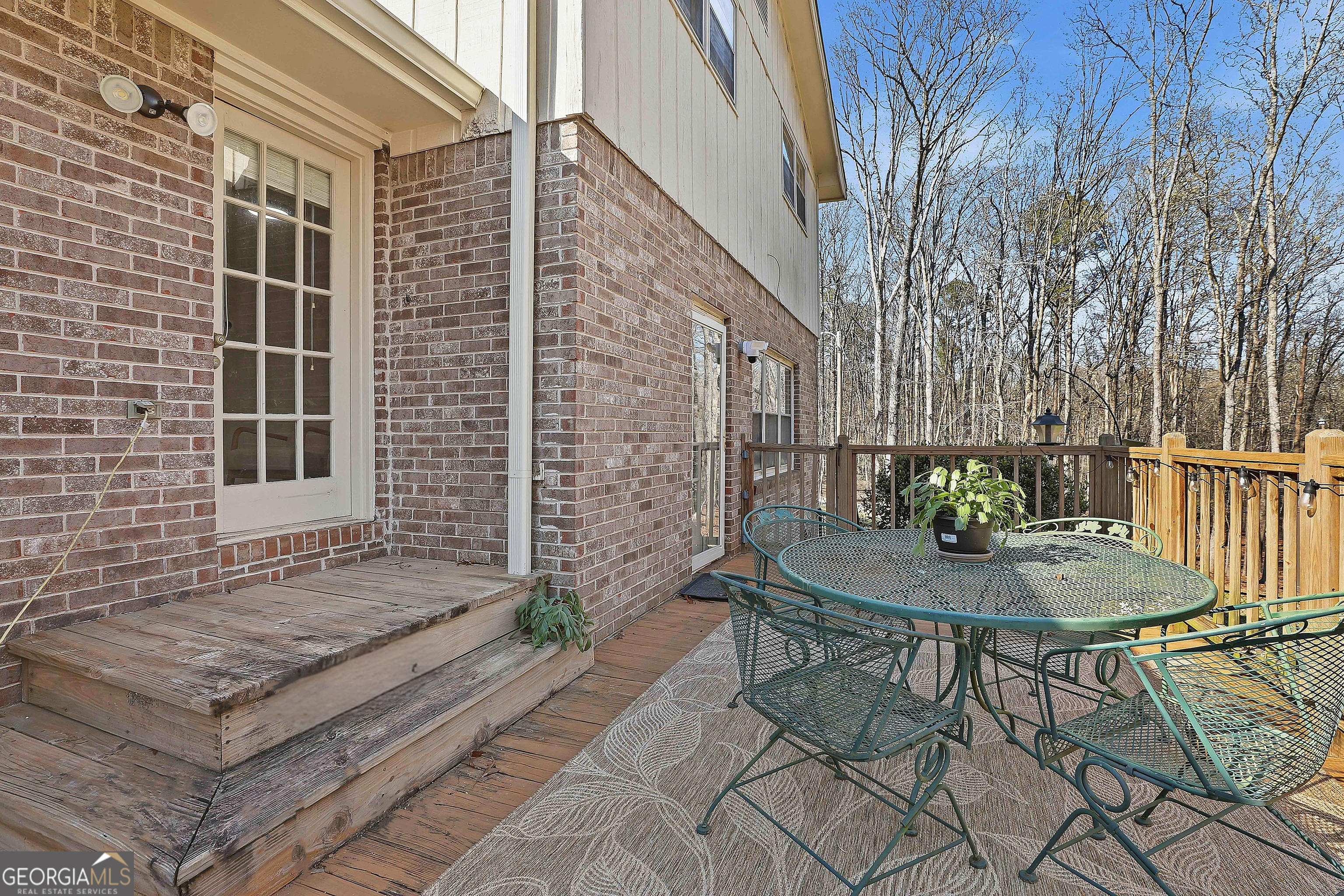 180 Lockwood Road Fayetteville, GA 30215 - Photo 24 of 59 a backyard of a house with table and chairs