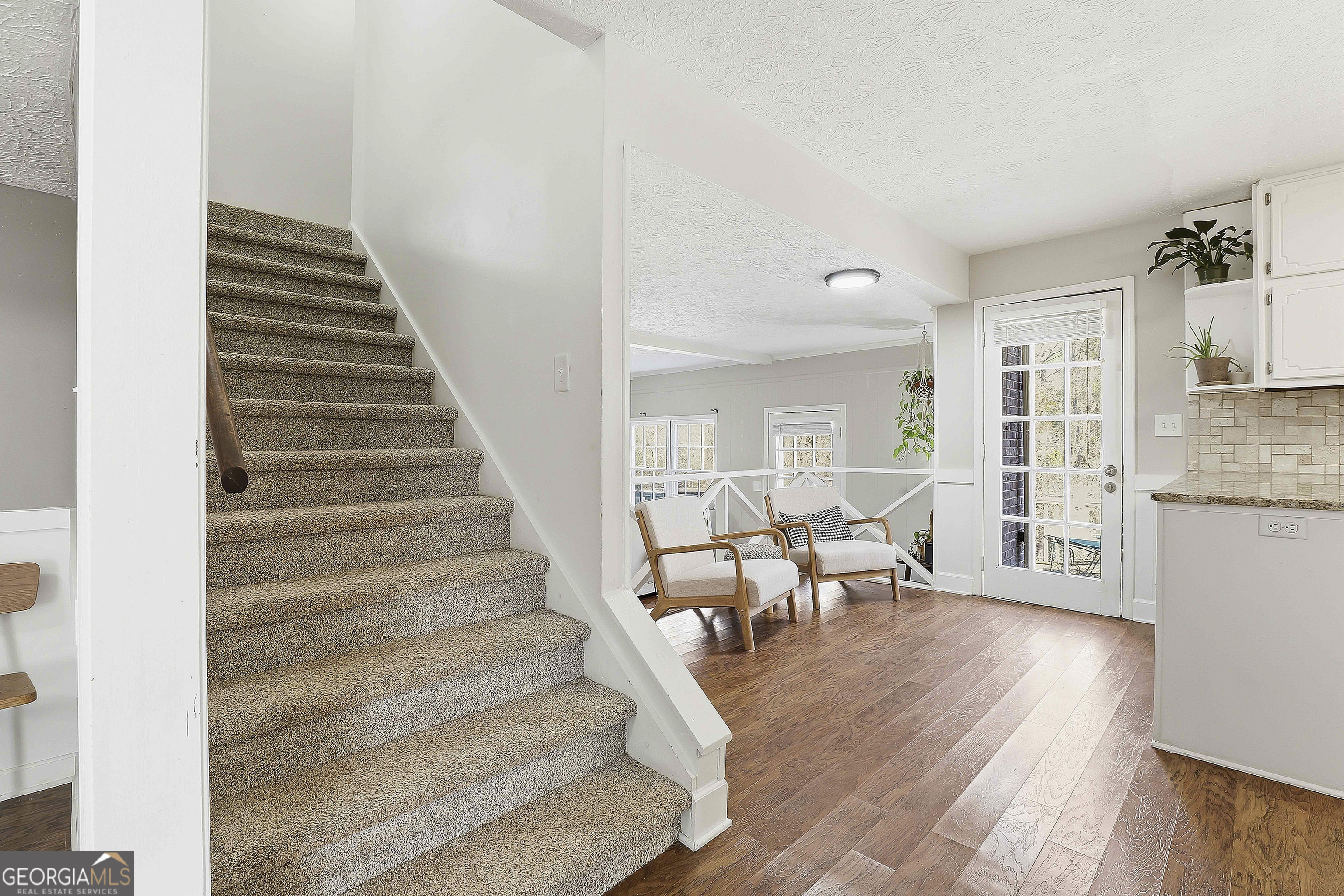 180 Lockwood Road Fayetteville, GA 30215 - Photo 27 of 59 a living room with furniture and wooden floor