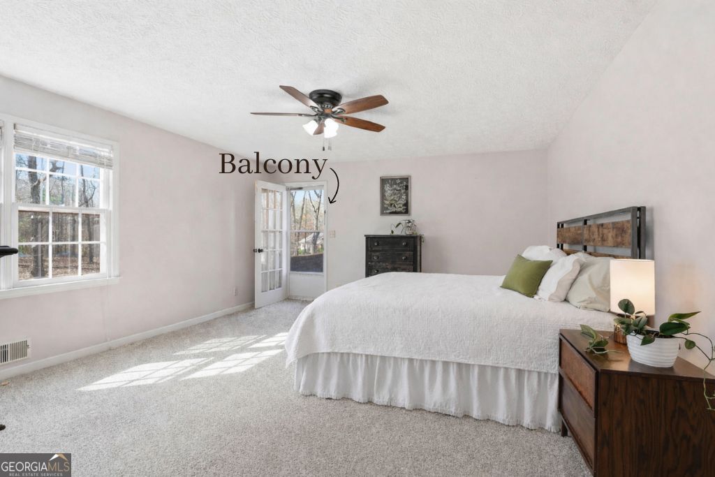 180 Lockwood Road Fayetteville, GA 30215 - Photo 29 of 59 a bedroom with a bed and window