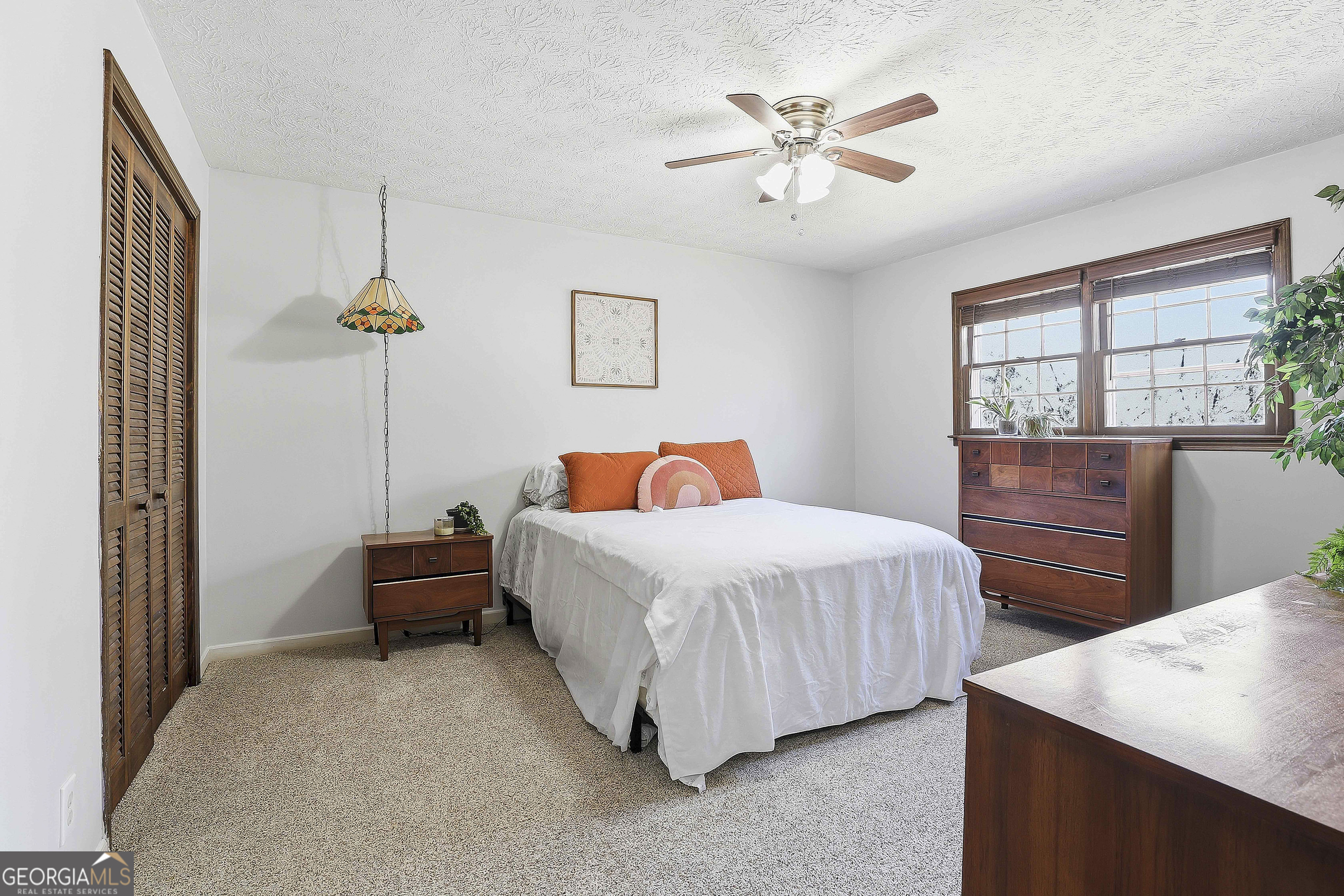 180 Lockwood Road Fayetteville, GA 30215 - Photo 38 of 59 a bedroom with bed and window