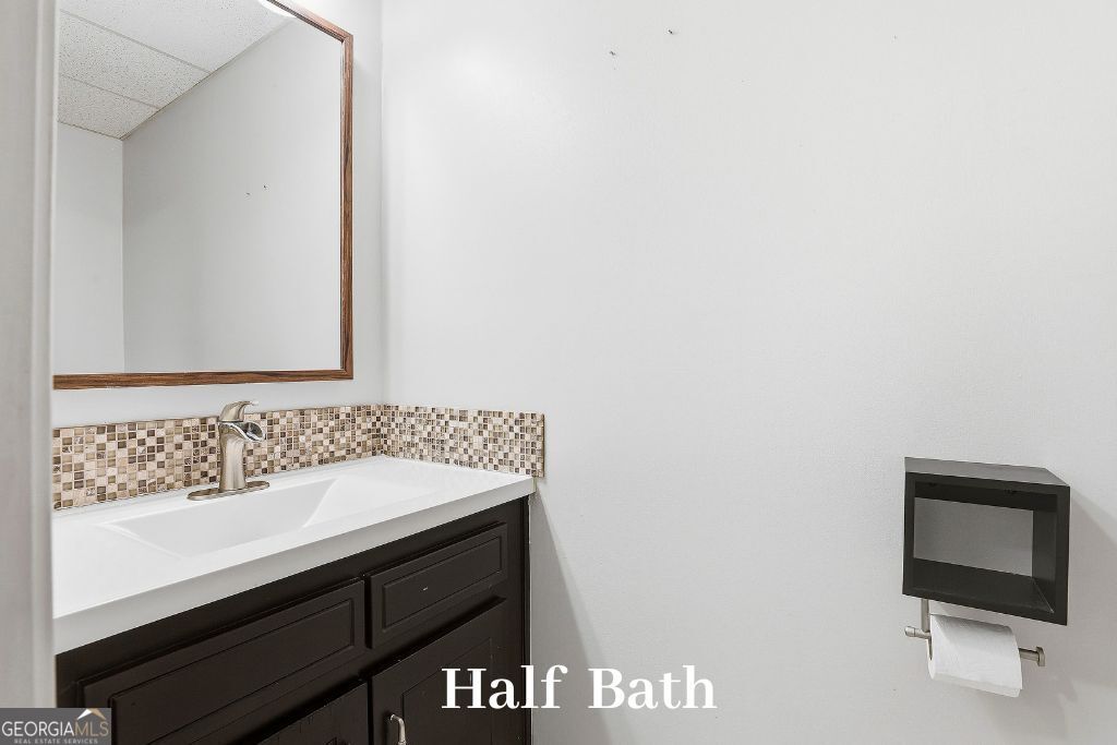 180 Lockwood Road Fayetteville, GA 30215 - Photo 40 of 59 a bathroom with a sink and a mirror