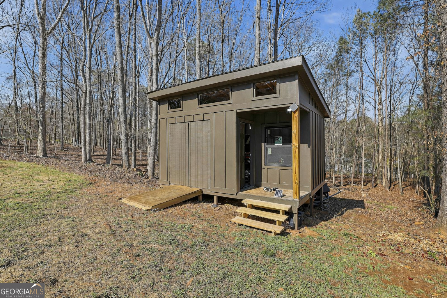 180 Lockwood Road Fayetteville, GA 30215 - Photo 46 of 59 a view of a small house with backyard