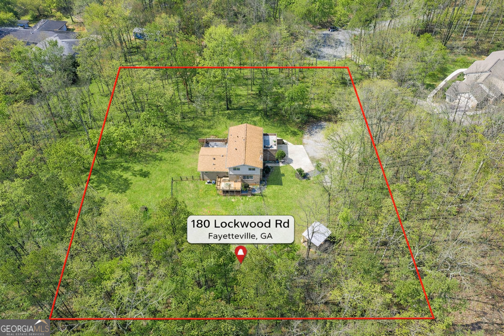 180 Lockwood Road Fayetteville, GA 30215 - Photo 55 of 59 a sign broad in the middle of a forest