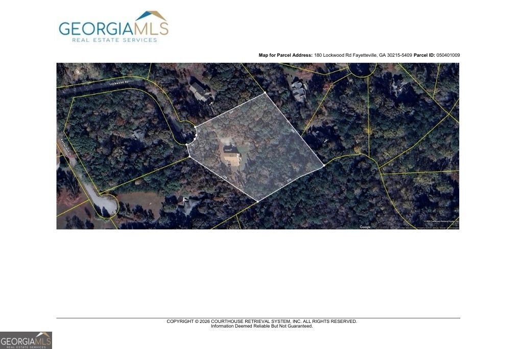 180 Lockwood Road Fayetteville, GA 30215 - Photo 58 of 59 a black and white photo of a room