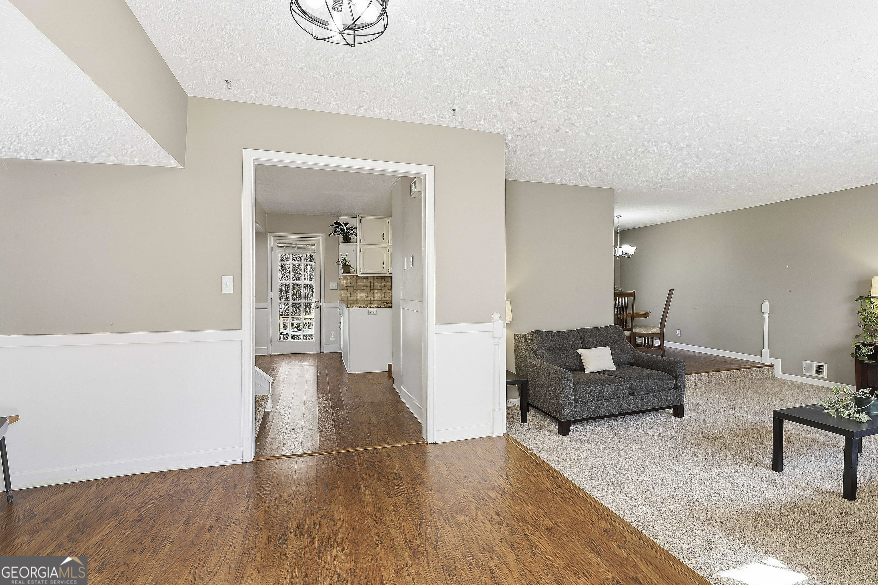 180 Lockwood Road Fayetteville, GA 30215 - Photo 9 of 59 a living room with furniture and a wooden floor