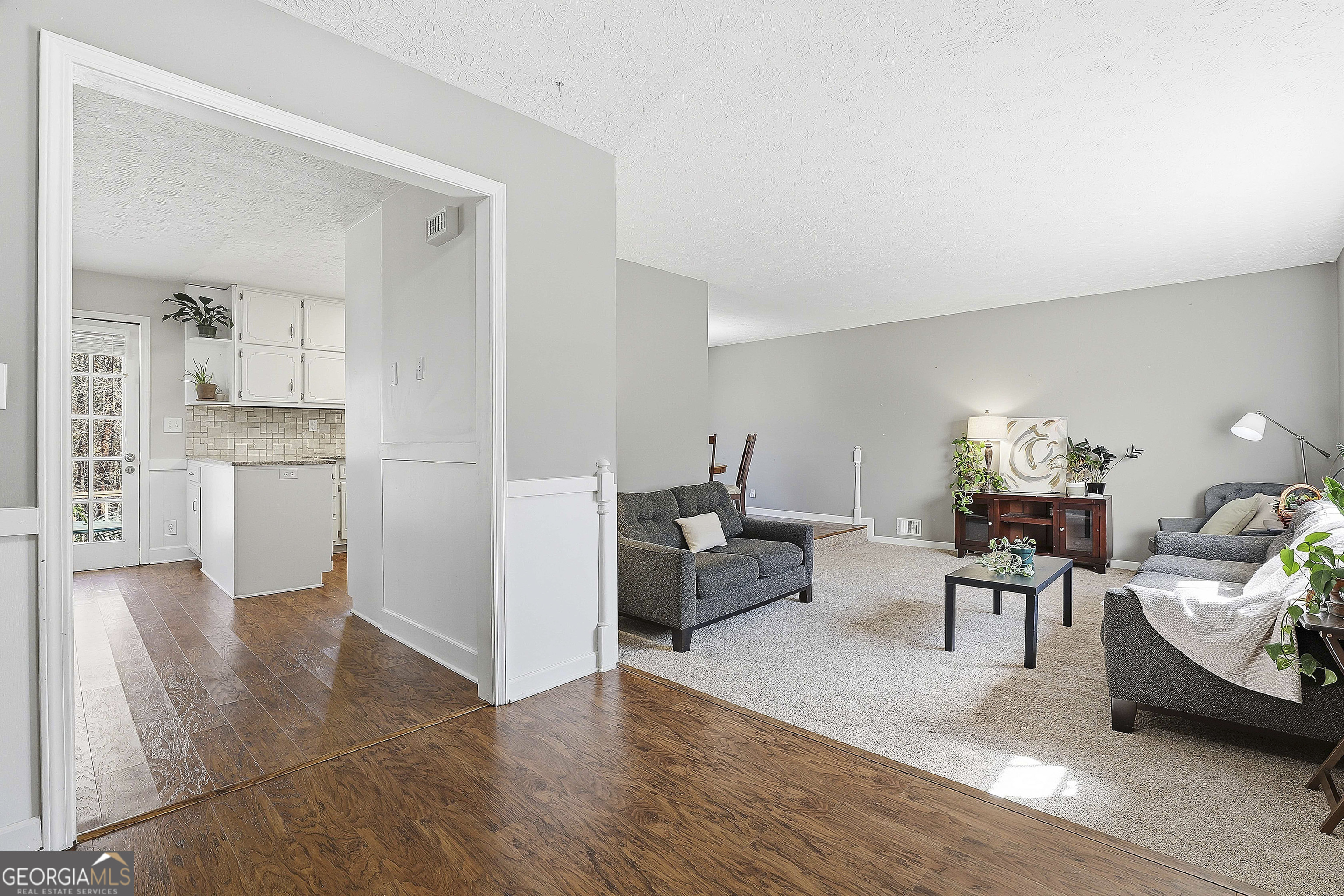 180 Lockwood Road Fayetteville, GA 30215 - Photo 10 of 59 a living room with furniture and view of kitchen