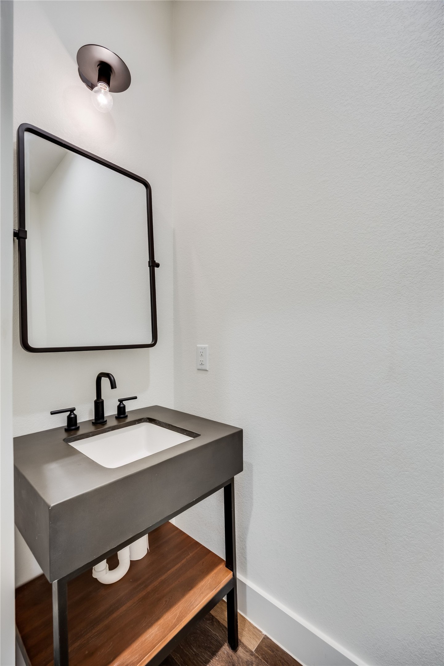 288 Smoke Tree Circle Dripping Springs, TX 78620 - Photo 20 of 40 a bathroom with a sink a mirror and vanity