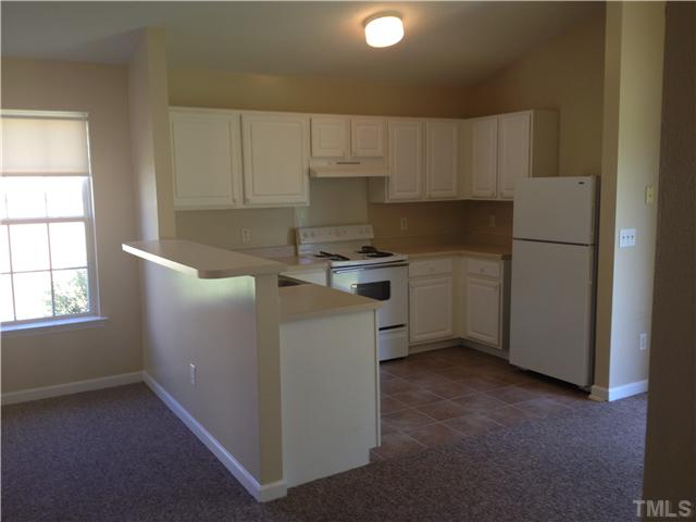 5400 Marthonna Way Raleigh, NC 27616 - Photo 3 of 4 a kitchen with a cabinets and white appliances
