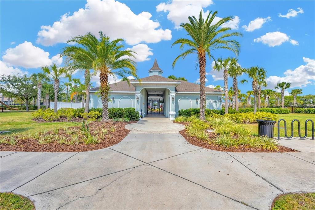 14350 Easy Goer Street Ruskin, FL 33573 - Photo 18 of 23 a front view of a building with garden