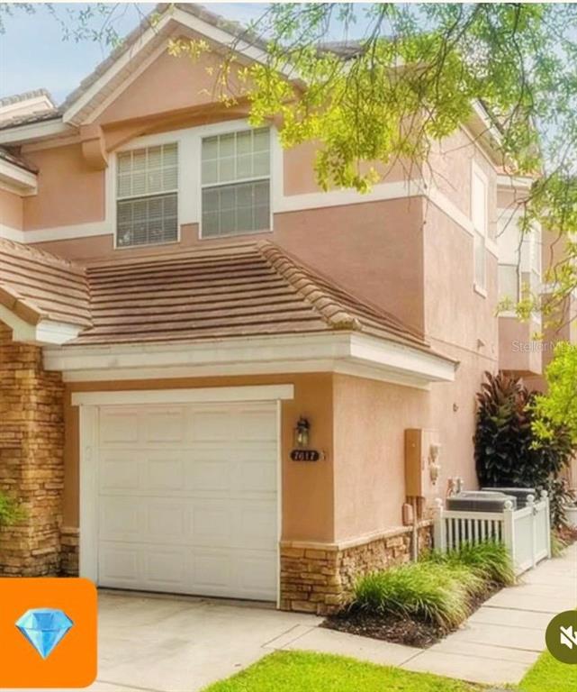 7617 Bayport Road, Unit 57 Orlando, FL 32819 - Photo 1 of 39 a view of a house with a yard and front a house