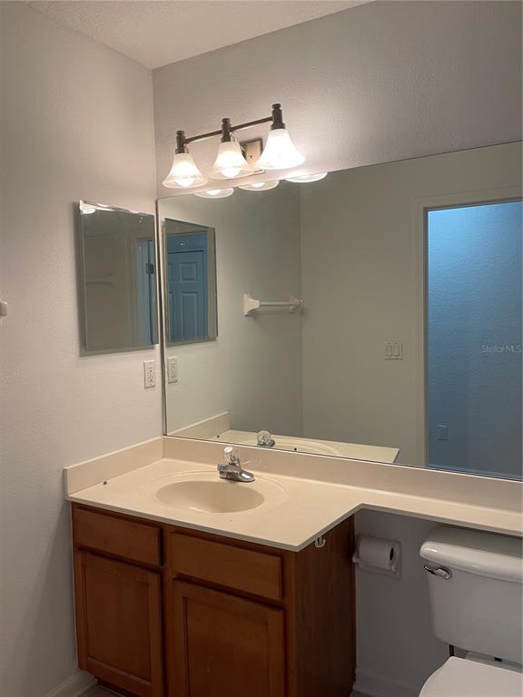 7617 Bayport Road, Unit 57 Orlando, FL 32819 - Photo 23 of 39 a bathroom with a sink and a mirror