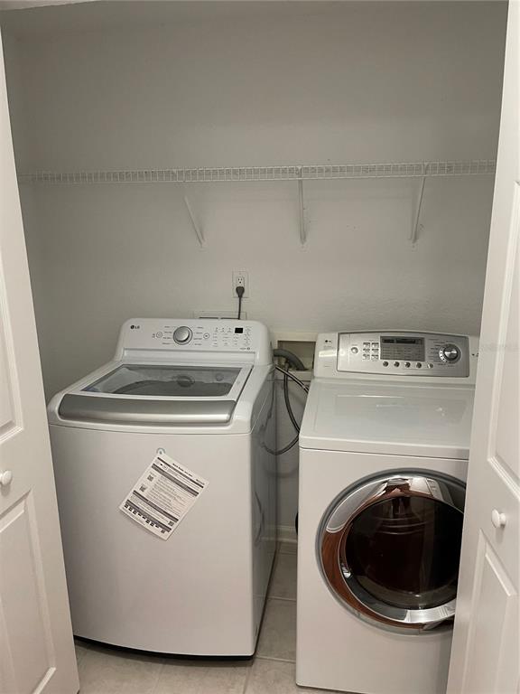 7617 Bayport Road, Unit 57 Orlando, FL 32819 - Photo 25 of 39 a utility room with dryer and washer