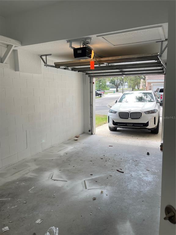 7617 Bayport Road, Unit 57 Orlando, FL 32819 - Photo 30 of 39 a car parked in garage