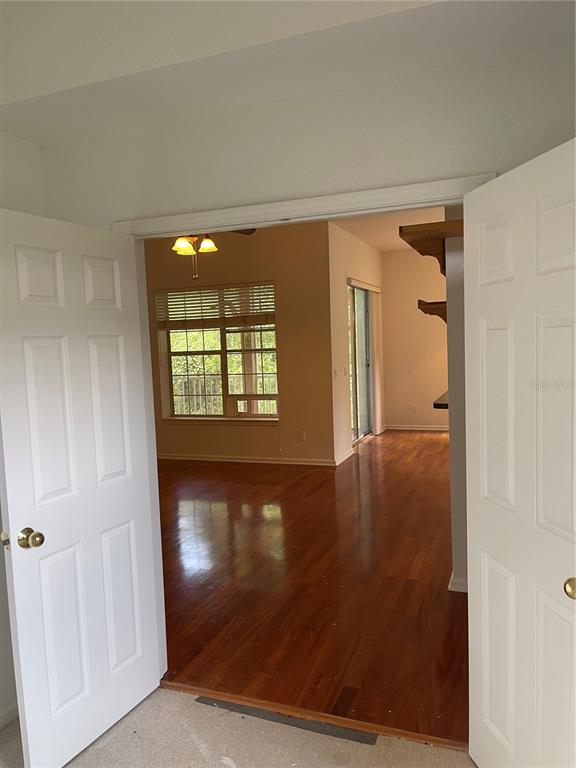 7617 Bayport Road, Unit 57 Orlando, FL 32819 - Photo 32 of 39 wooden floor in an empty room with a window
