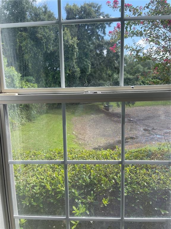 7617 Bayport Road, Unit 57 Orlando, FL 32819 - Photo 35 of 39 a view of a glass door with a yard