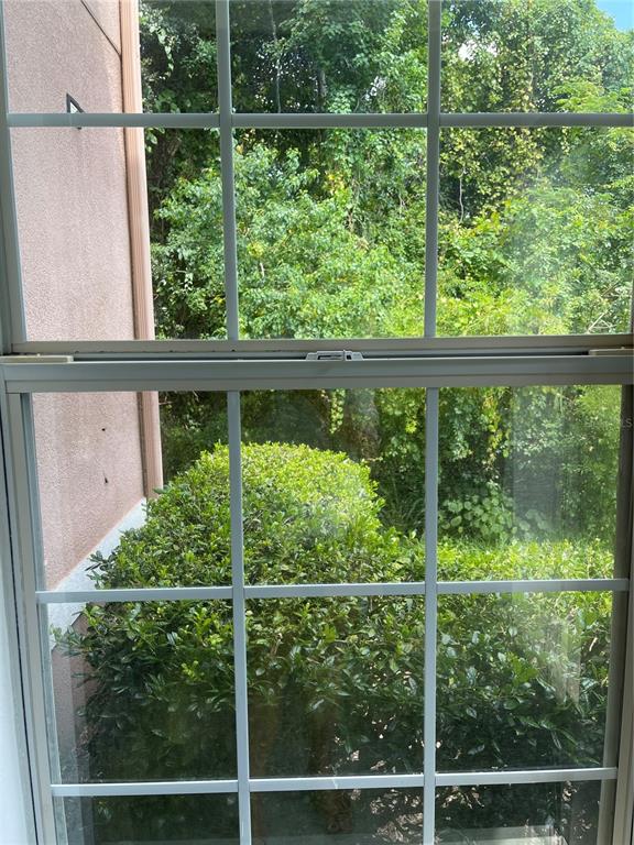 7617 Bayport Road, Unit 57 Orlando, FL 32819 - Photo 36 of 39 a view of a fence from a window