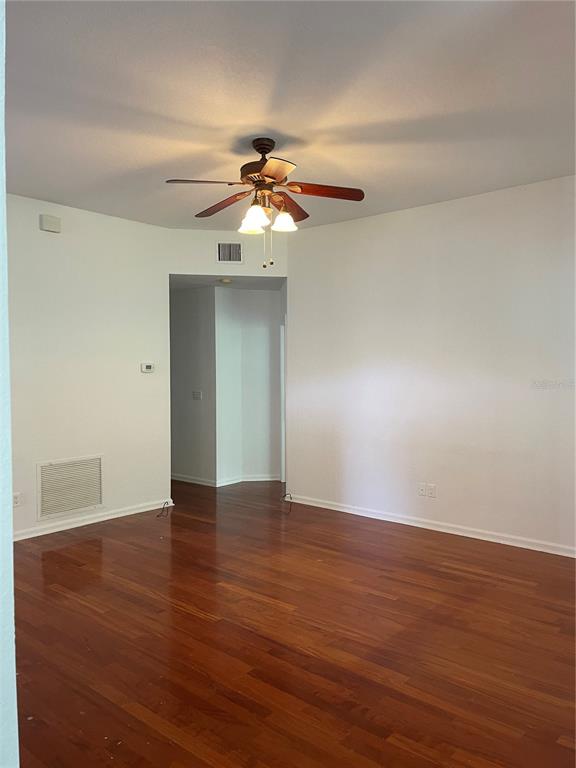 7617 Bayport Road, Unit 57 Orlando, FL 32819 - Photo 39 of 39 a view of an empty room with wooden floor