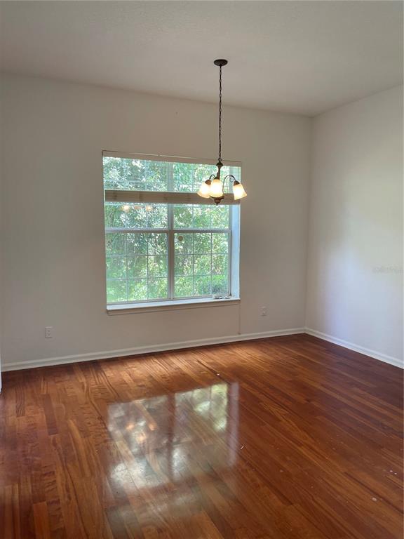 7617 Bayport Road, Unit 57 Orlando, FL 32819 - Photo 7 of 39 a view of an empty room with windows and an oven