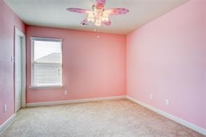 2723 Intrepid Trail Rosenberg, TX 77471 - Photo 22 of 30
Secondary Bedroom #1 features a walk-in closet.