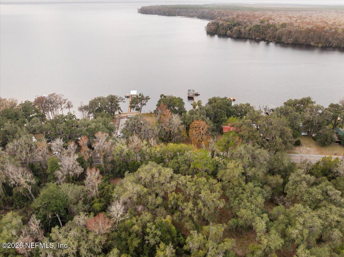 an aerial view of a house with a lake view