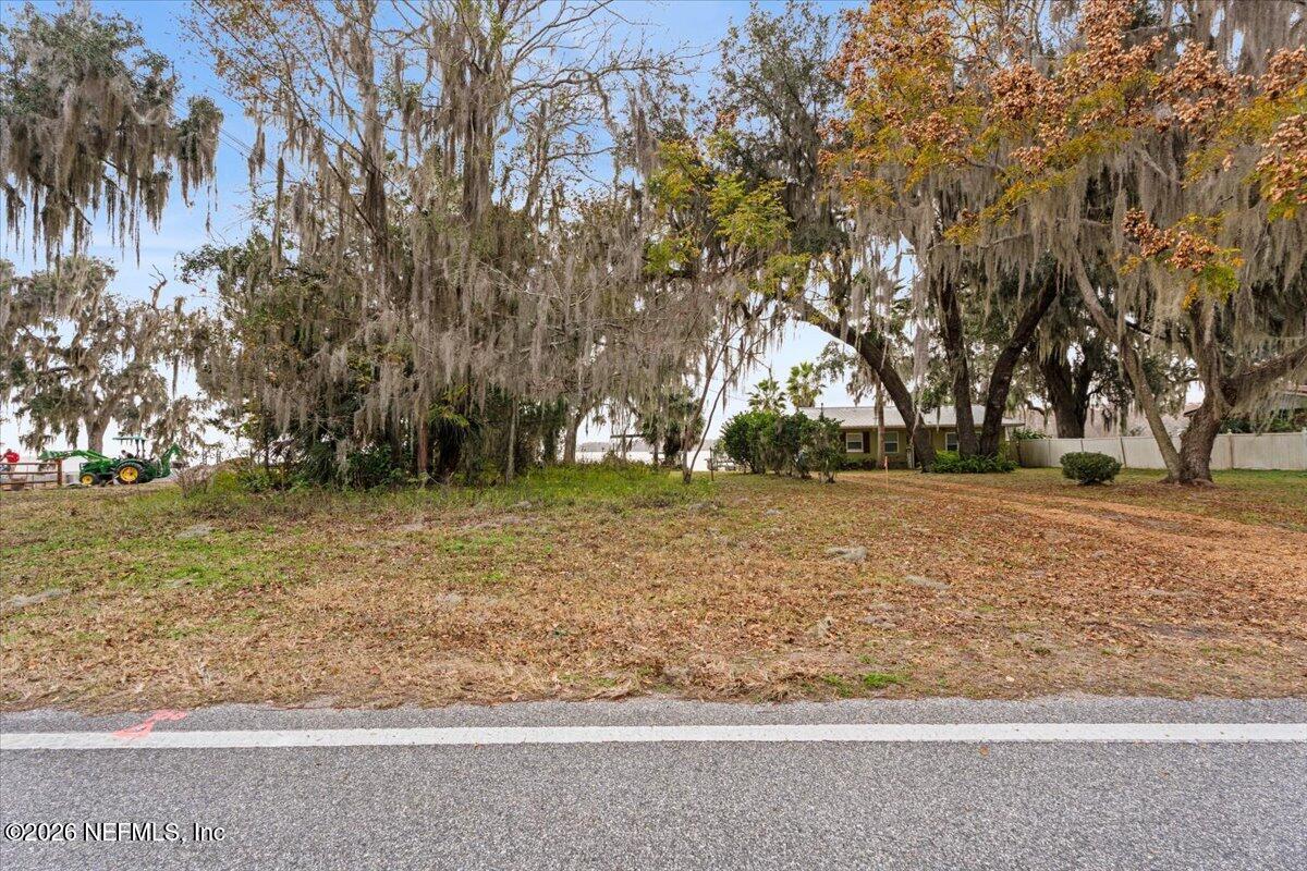 13607 County Road 13 North St. Augustine, FL 32092 - Photo 7 of 11 a view of outdoor space with deck and trees