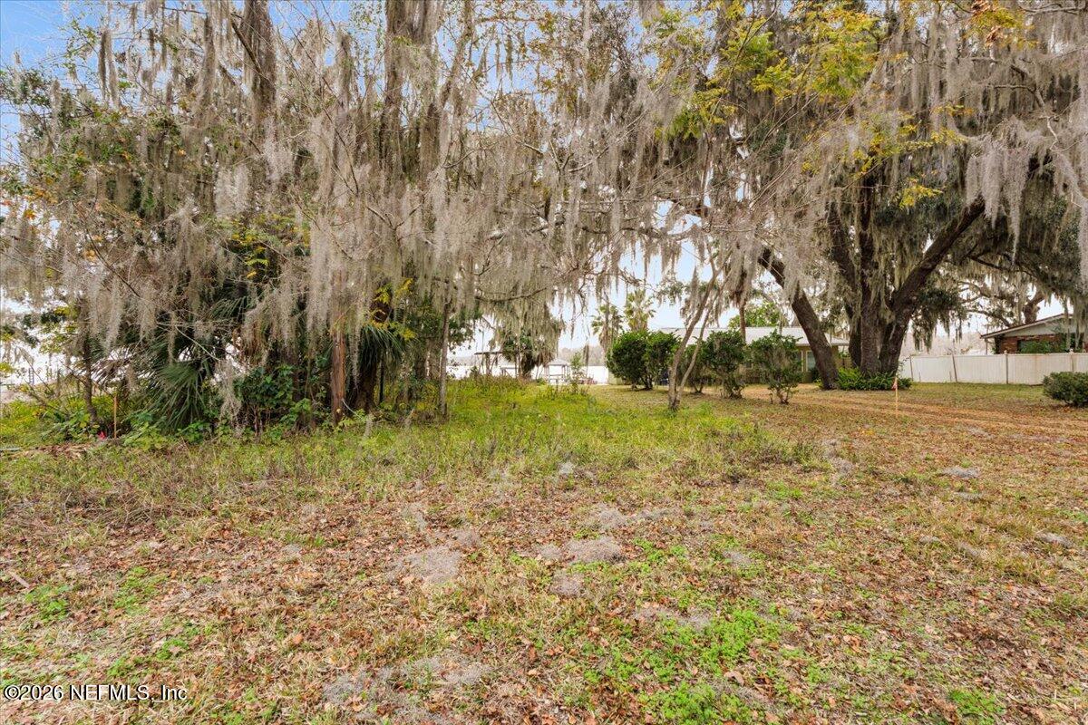 13607 County Road 13 North St. Augustine, FL 32092 - Photo 10 of 11 a view of outdoor space with trees all around