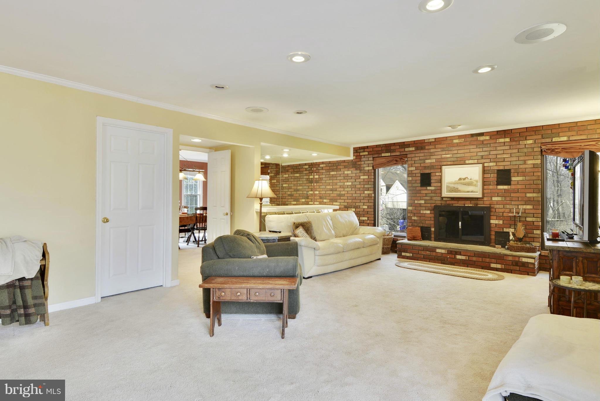 9 Redgate Court Silver Spring, MD 20905 - Photo 7 of 29 a living room with couch and a flat screen tv