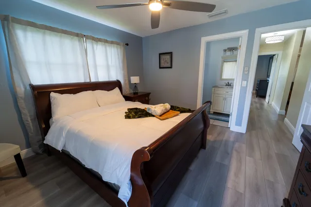 a bed room with a bed and a chandelier