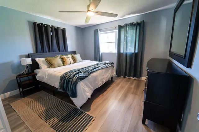 a bedroom with double bed and a window