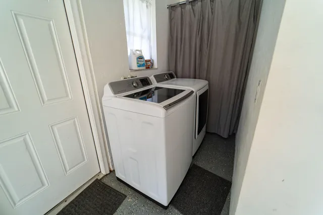 a utility room with dryer and washer