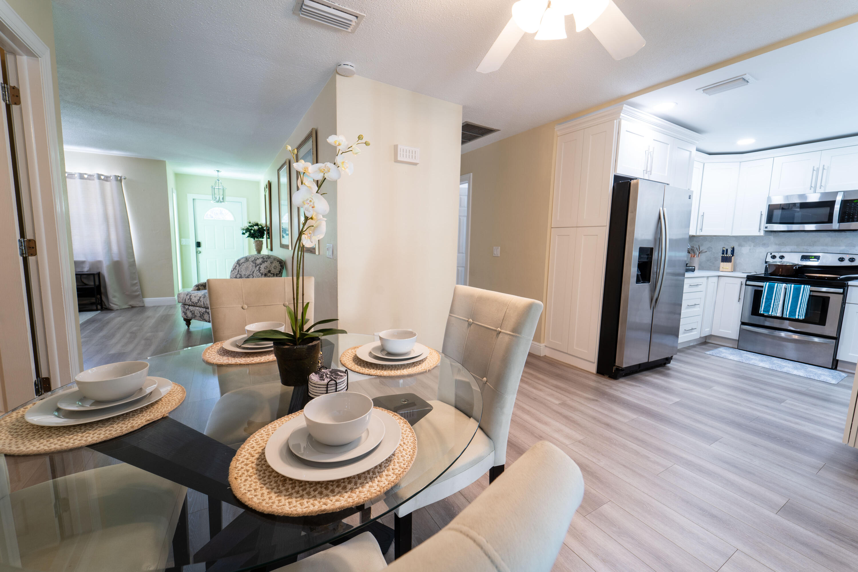 Undisclosed Address Lake Worth, FL 33461 - Photo 6 of 33 a dining room with furniture and wooden floor