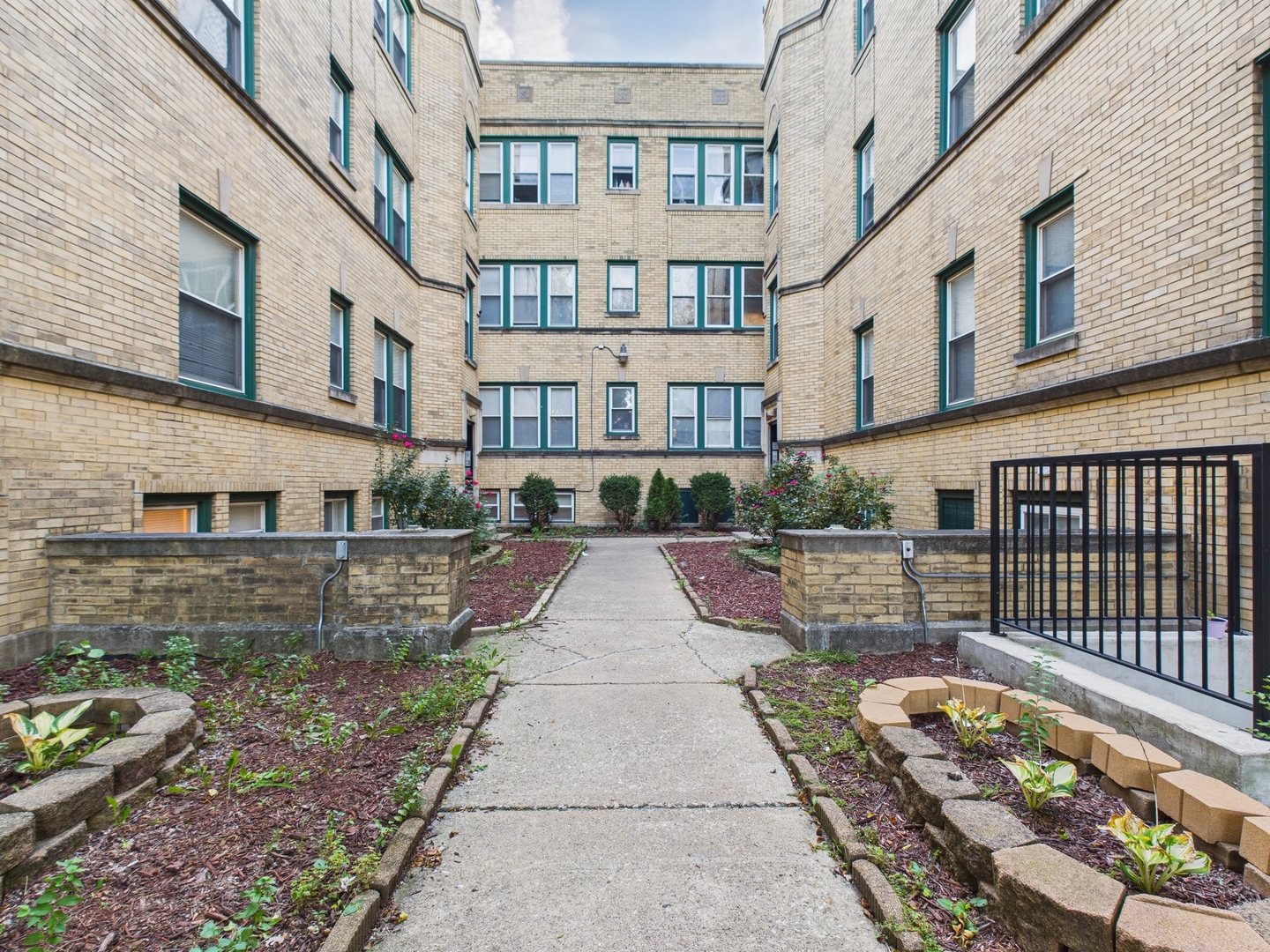 6652 South University Avenue, Unit 3B Chicago, IL 60637 - Photo 1 of 14 a view of a building with many windows