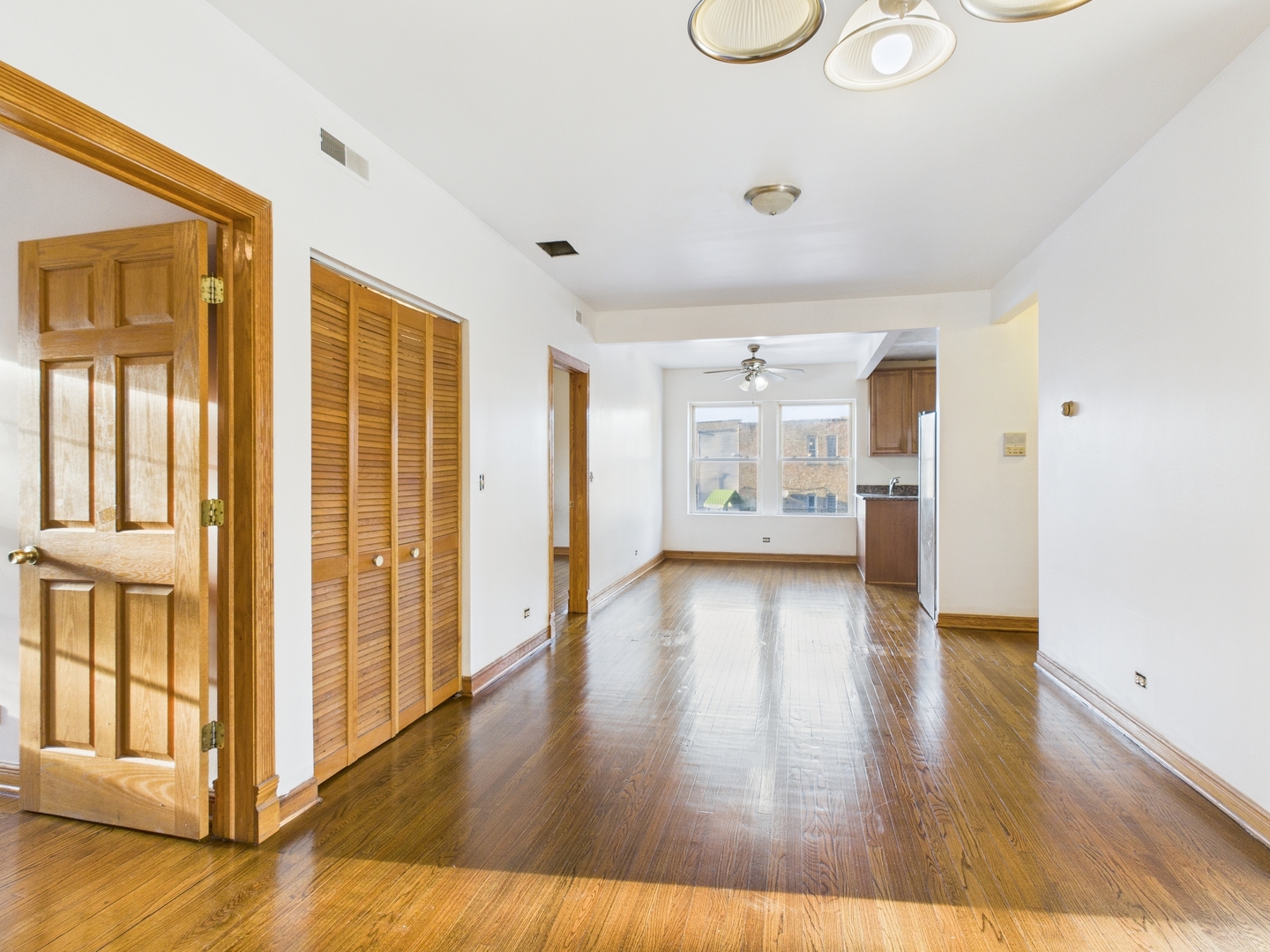 6652 South University Avenue, Unit 3B Chicago, IL 60637 - Photo 5 of 14 a view of empty room with wooden floor