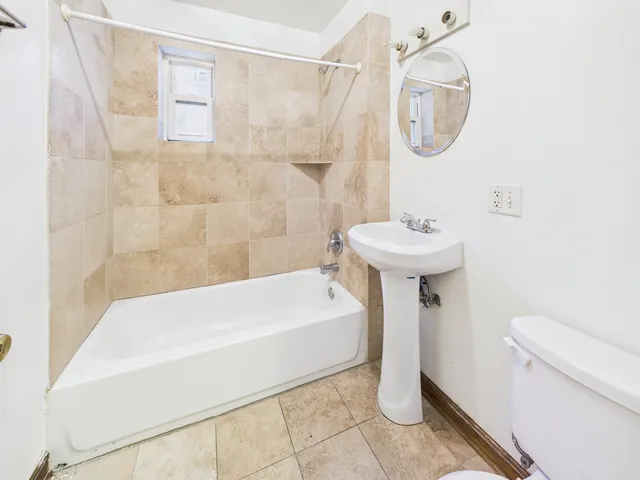 a bathroom with a sink a toilet and a bathtub